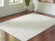 Ashley Furniture Harjot Rug in a 4x3 cropped view, showcasing a patterned area rug with intricate design and rich colors.