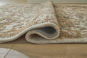 Close-up of a Sableridge Medium Rug by Ashley Furniture, showing its detailed woven pattern and soft textured surface.