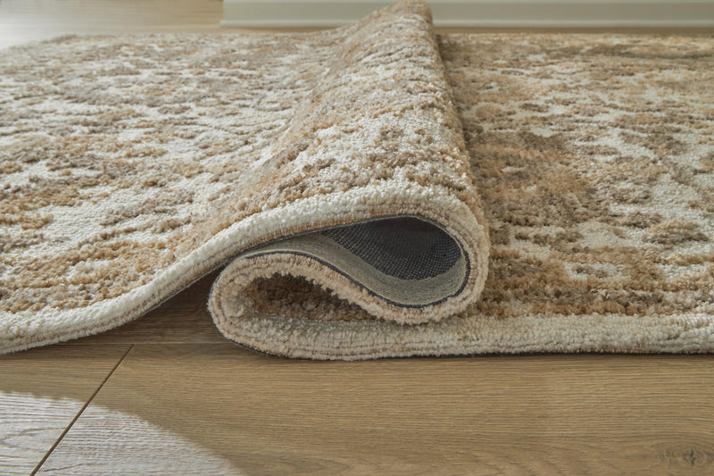 Close-up of a Sableridge Medium Rug by Ashley Furniture, showing its detailed woven pattern and soft textured surface.