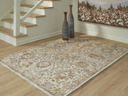Ashley Furniture Sableridge Medium Rug with intricate patterns in neutral colors, perfect for living room or bedroom decor.