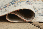 Close-up of Ashley Furniture Jarrpage Rug showing intricate patterns and textured fabric in neutral tones.