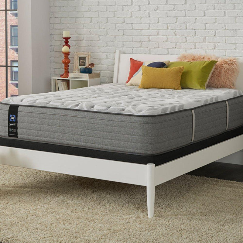 Sealy Lavina II innerspring mattress with plush top, showing its layered fabric and supportive construction in a bedroom setting.