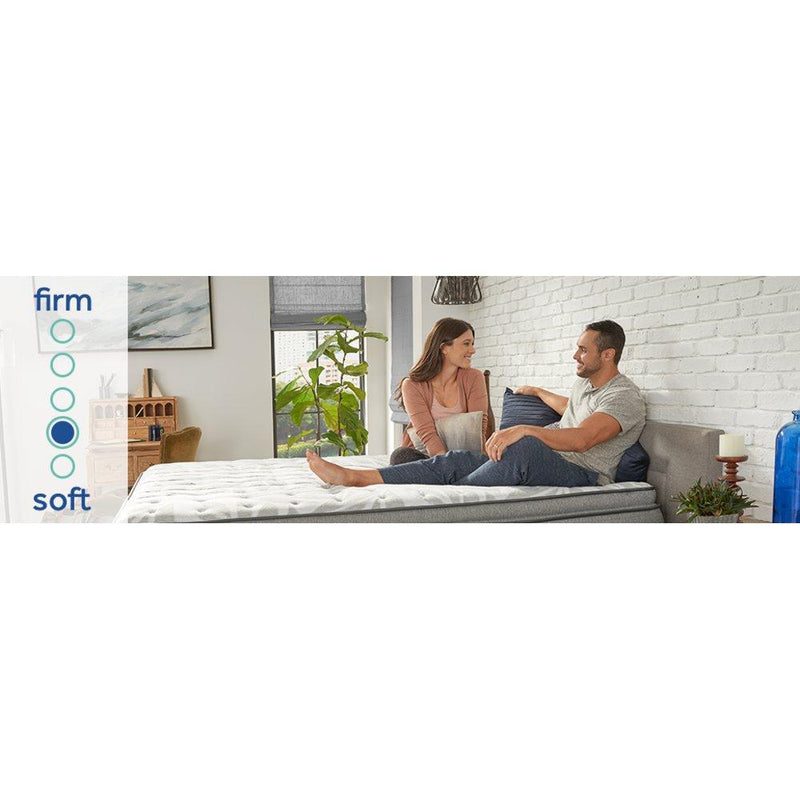 Sealy Red Maple innerspring mattress with plush fabric cover, showcasing its thickness and supportive design for comfortable sleep.