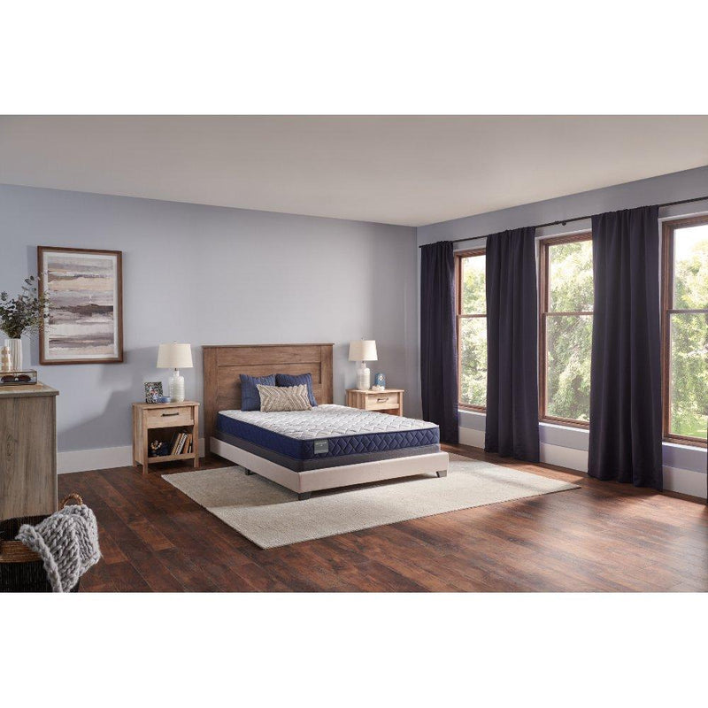 Sealy Oconee Foam Mattress with plush top layer and supportive edges, shown on a bed frame in a well-lit bedroom setting.
