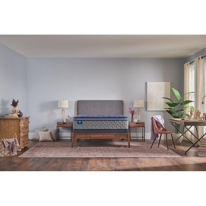 Sealy Grand Jewel innerspring mattress with plush top layer and supportive coils, shown in a neatly made bed setup.