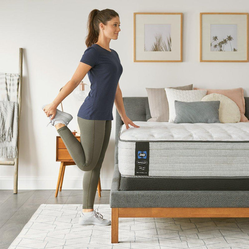 Sealy Garner II innerspring mattress showing plush fabric cover and supportive interior design for comfortable sleep.