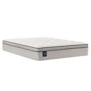 Sealy innerspring mattress with a plush top and supportive coils, shown in a neatly made bed setting.