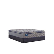 Sealy Opal House innerspring mattress with quilted surface and supportive layers, shown on a bed frame in a well-lit bedroom setting.