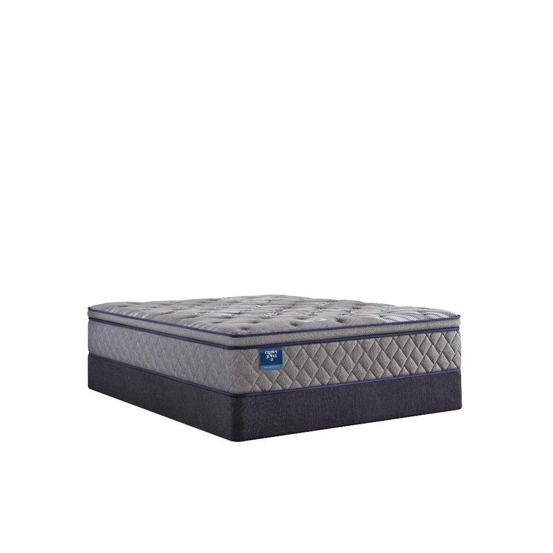 Sealy Opal House innerspring mattress with quilted surface and supportive layers, shown on a bed frame in a well-lit bedroom setting.