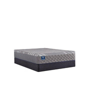 Sealy Sixth & Park hybrid mattress with plush top and supportive layers, shown in a bedroom setting for comfortable sleep.