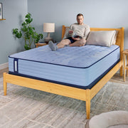 Sealy Maida Spring Mattress showing a plush, supportive surface with a fabric cover in a bedroom setting.