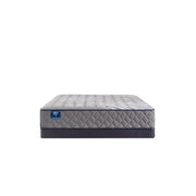Sealy Sixth & Park innerspring mattress with quilted top and supportive coils, shown in a well-made bed setup.