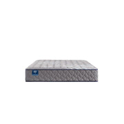 Sealy Sixth & Park Innerspring Mattress with plush top and supportive coils, shown on a bed frame in a bright bedroom setting.