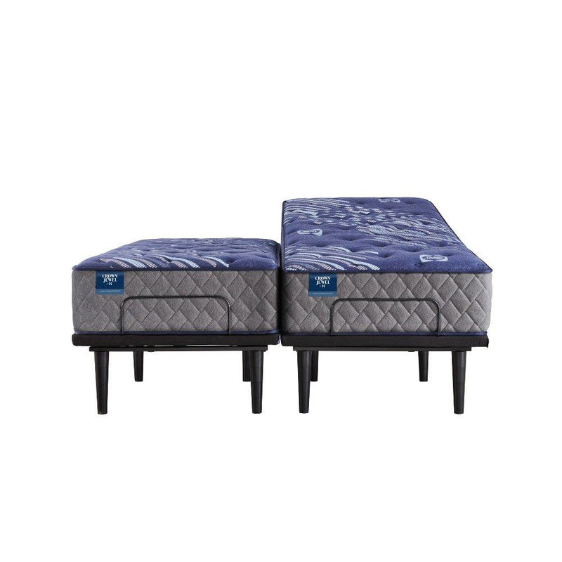 Sealy Grand Jewel innerspring mattress with a plush fabric cover and edge support, shown in a bedroom setting.