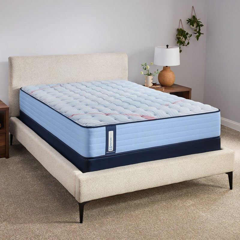 Sealy Fayette Spring Mattress showcasing a plush, supportive mattress with a quilted top in a bedroom setting.