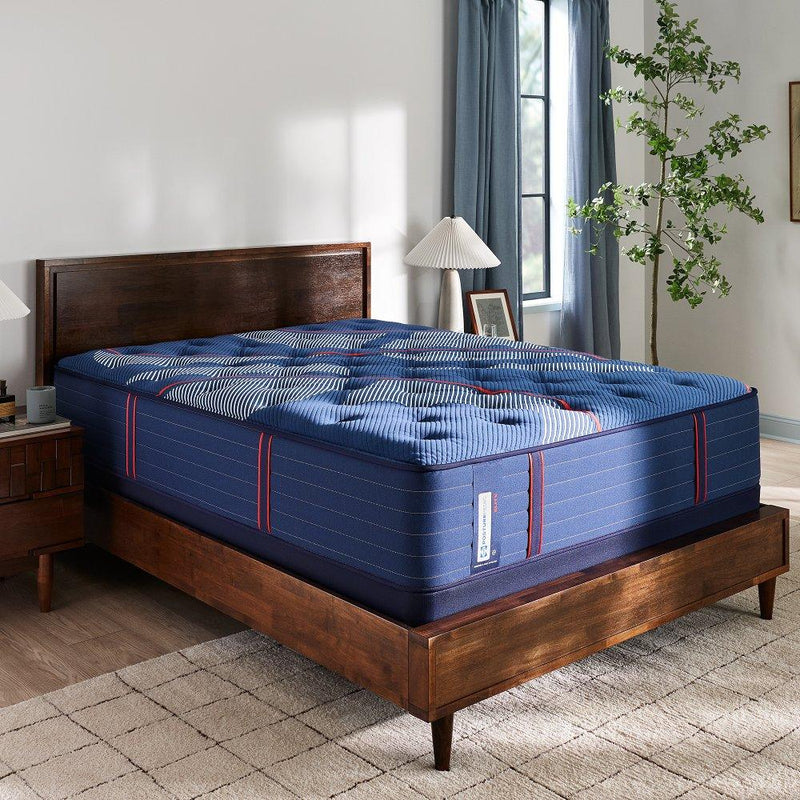 Sealy Brenham II Spring Mattress showing plush fabric surface with stitched edges and supportive construction for comfortable sleep.
