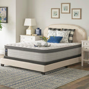 Sealy Garner II innerspring mattress with plush top, showing a close-up of the mattress surface and fabric detailing.