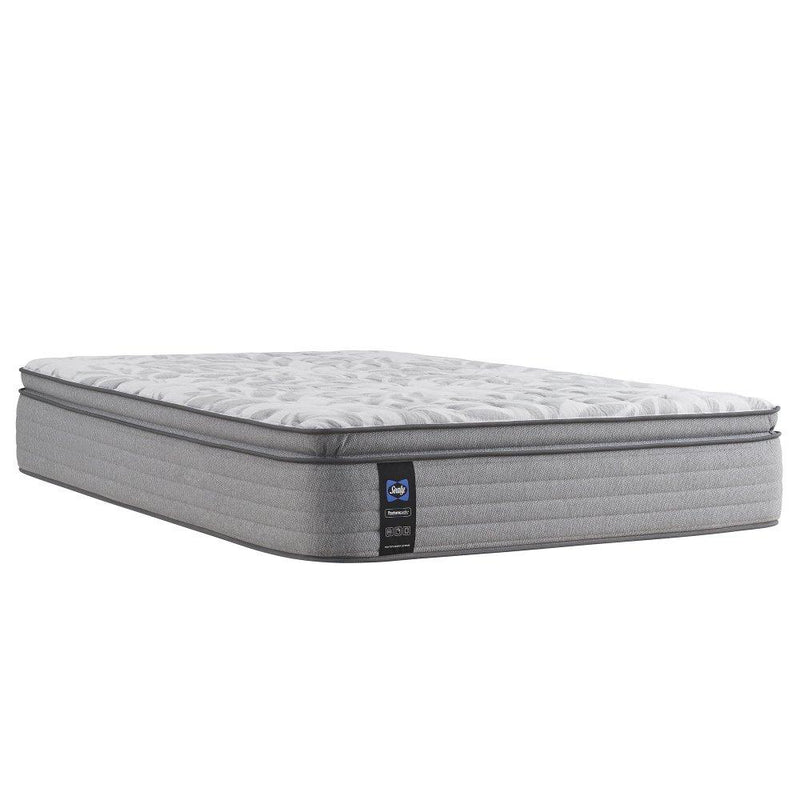 Sealy Red Maple innerspring mattress with a plush fabric cover, showcasing its supportive construction and comfortable sleeping surface.