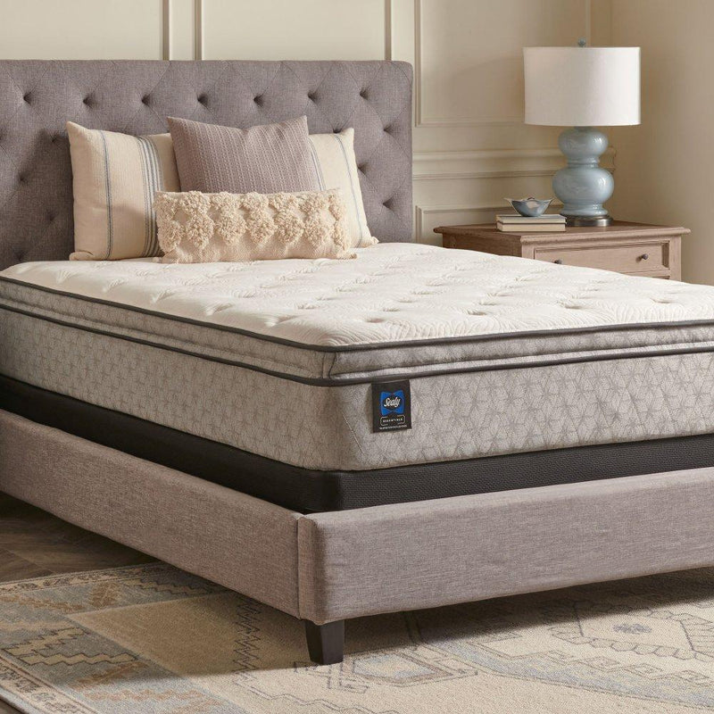 Sealy innerspring mattress showing a plush, quilted top with supportive coils and a neutral-colored fabric cover.