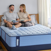 Sealy Newland Spring Mattress with plush fabric cover and supportive foam layers, designed for comfort and restful sleep.