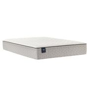 Sealy innerspring mattress with a quilted top and supportive layers, shown on a bed frame in a well-lit bedroom setting.