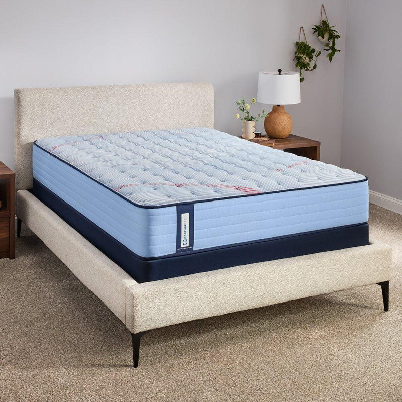 Sealy Fayette Spring Mattress showcasing a plush, supportive mattress with a quilted top and Sealy branding.
