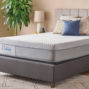 Sealy Elsanta Hybrid Mattress with plush top and supportive layers, shown with a neatly made bed in a cozy bedroom setting.