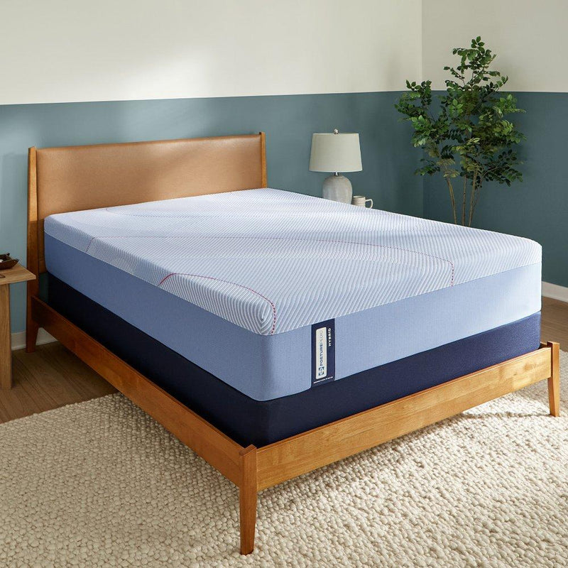 Sealy Kennett Hybrid Mattress with plush top and supportive base, shown on a bed with neutral bedding in a bedroom setting.