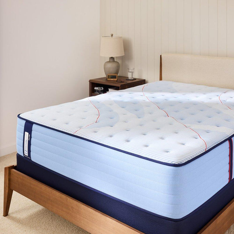 Sealy Plainfield Mattress in a bedroom setting showing a plush, supportive mattress with a quilted top and neutral bedding.