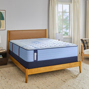 Sealy Newland Spring Mattress showing a plush, supportive mattress with a quilted top and neutral fabric cover.