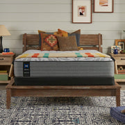 Sealy Red Maple innerspring mattress with plush fabric cover and supportive coils, shown in a bedroom setting.