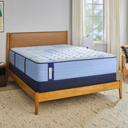 Sealy Newland Spring Mattress showing a plush, supportive mattress with quilted surface and brand logo in a well-lit bedroom scene.
