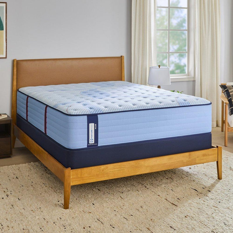 Sealy Newland Spring Mattress showing a plush, supportive mattress with quilted surface and brand logo in a well-lit bedroom scene.