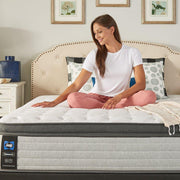 Sealy Garner II innerspring mattress with white quilted top and supportive construction for comfortable sleep.