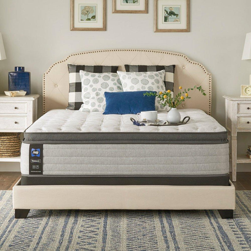 Sealy Garner II innerspring mattress with white quilted top and supportive edge, designed for comfort and durability.