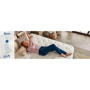 Sealy Spruce Innerspring Mattress with quilted top and supportive coils, shown with clean white bedding for a comfortable sleep surface.