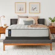 Sealy Garner II innerspring mattress with quilted top and supportive coils, shown in a well-made, plush bedroom setting.