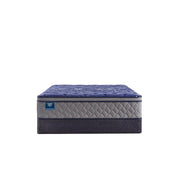 Sealy Grand Jewel innerspring mattress with plush surface and supportive coils, shown in a bedroom setting.