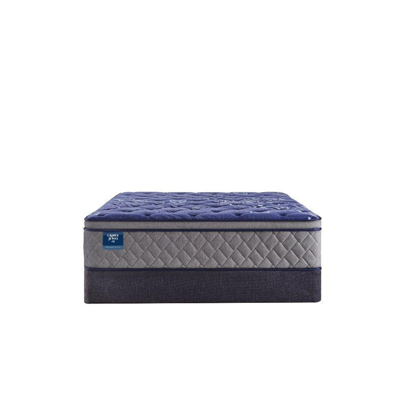 Sealy Grand Jewel innerspring mattress with plush surface and supportive coils, shown in a bedroom setting.