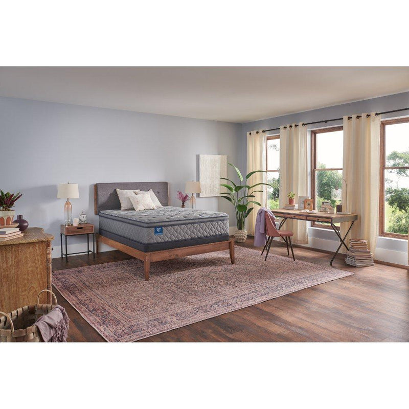 Sealy Opal House innerspring mattress with quilted top, visible layers, and supportive design for comfortable sleep.