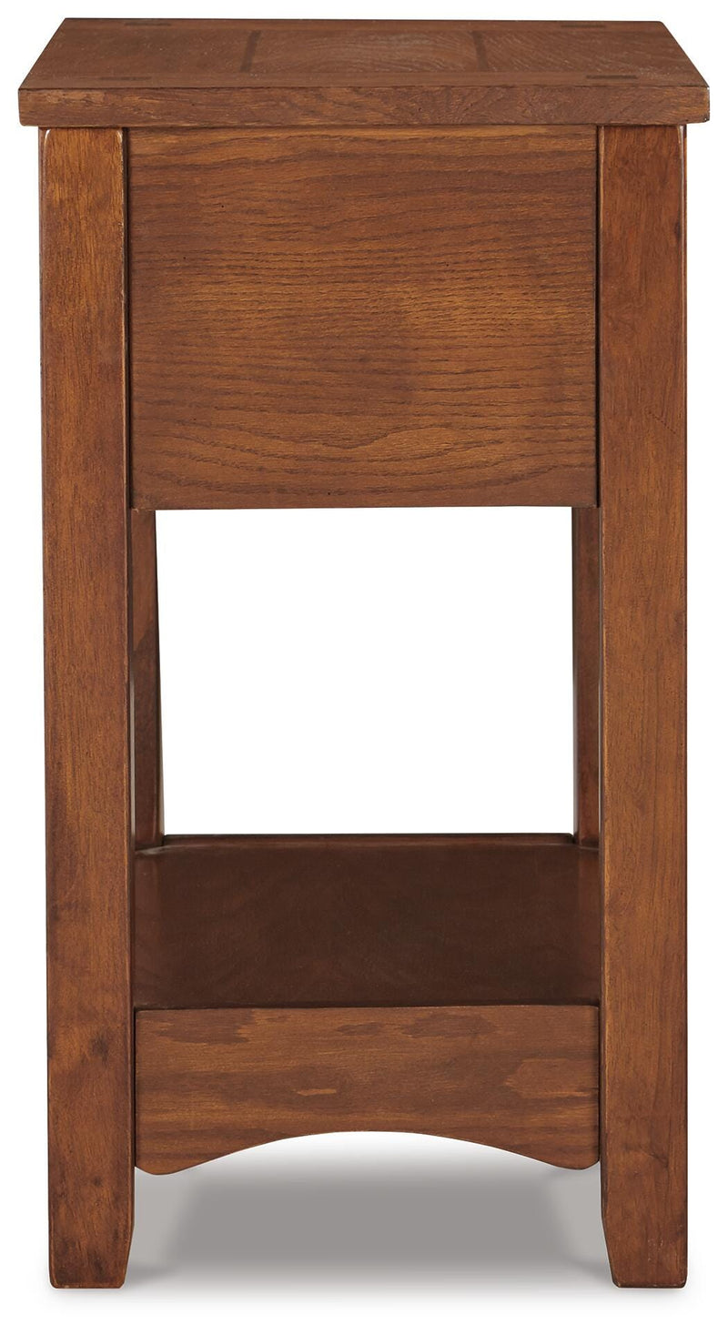 Ashley Furniture Breegin chairside end table with a sleek wooden top and sturdy legs, designed for convenient side placement.
