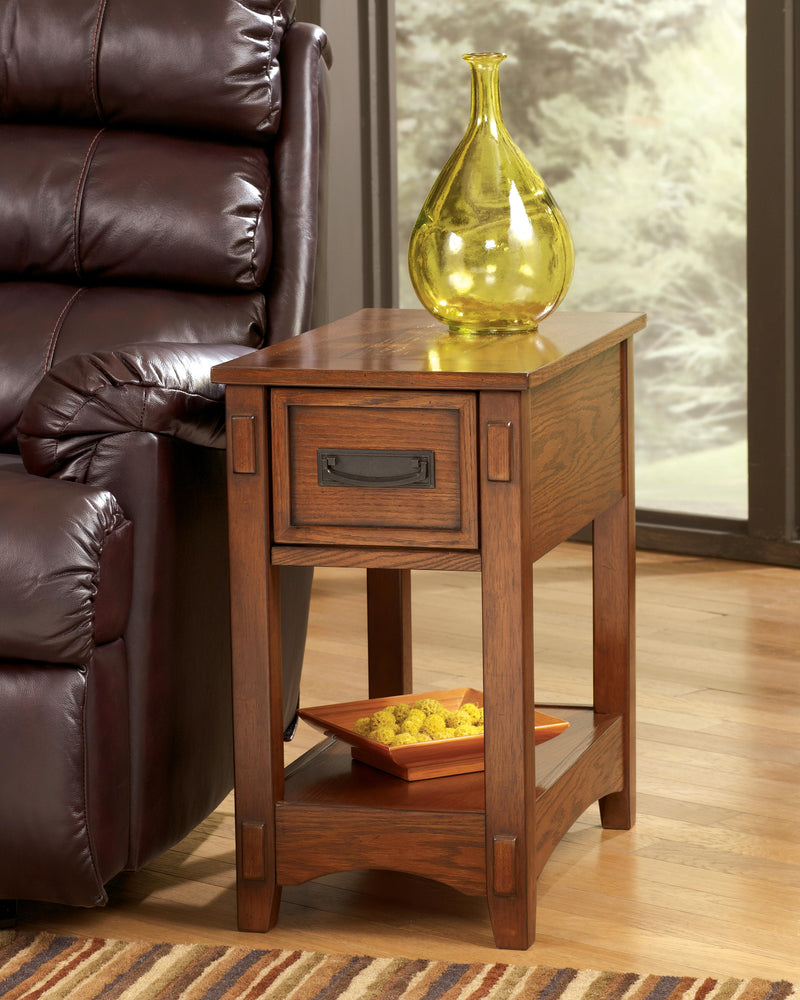 Ashley Furniture Breegin chairside end table showing a wooden surface with a drawer and lower shelf for storage.