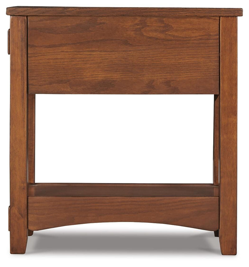 Ashley Furniture Breegin chairside end table with a dark wood finish and modern design, shown from a side view.