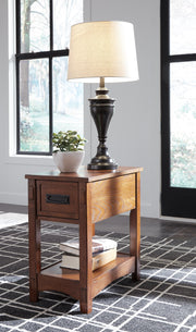 Ashley Furniture Breegin chairside end table with a wood finish, featuring a compact design suitable for living room seating areas.