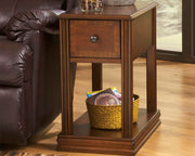 Ashley Furniture Breegin chairside end table with a sleek wooden top and sturdy legs, designed for convenient beside seating.