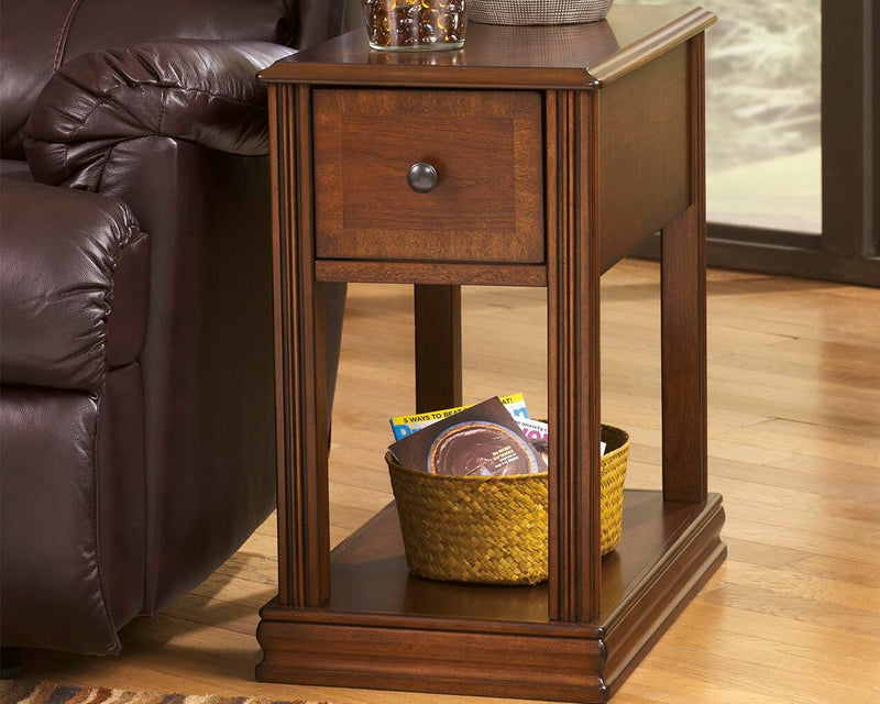 Ashley Furniture Breegin chairside end table with a sleek wooden top and sturdy legs, designed for convenient beside seating.