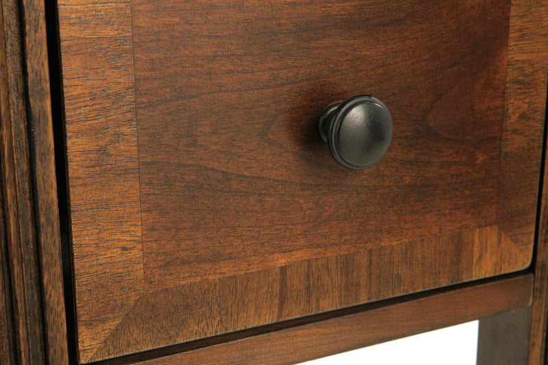 Ashley Furniture Breegin chairside end table with a wooden top and metal frame, perfect for next to a sofa or chair.