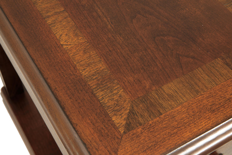 Ashley Furniture Breegin chairside end table with a dark wood finish, featuring a compact design and smooth tabletop surface.
