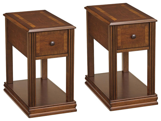 Ashley Furniture Breegin end table set featuring two modern wooden tables with sleek black metal legs.