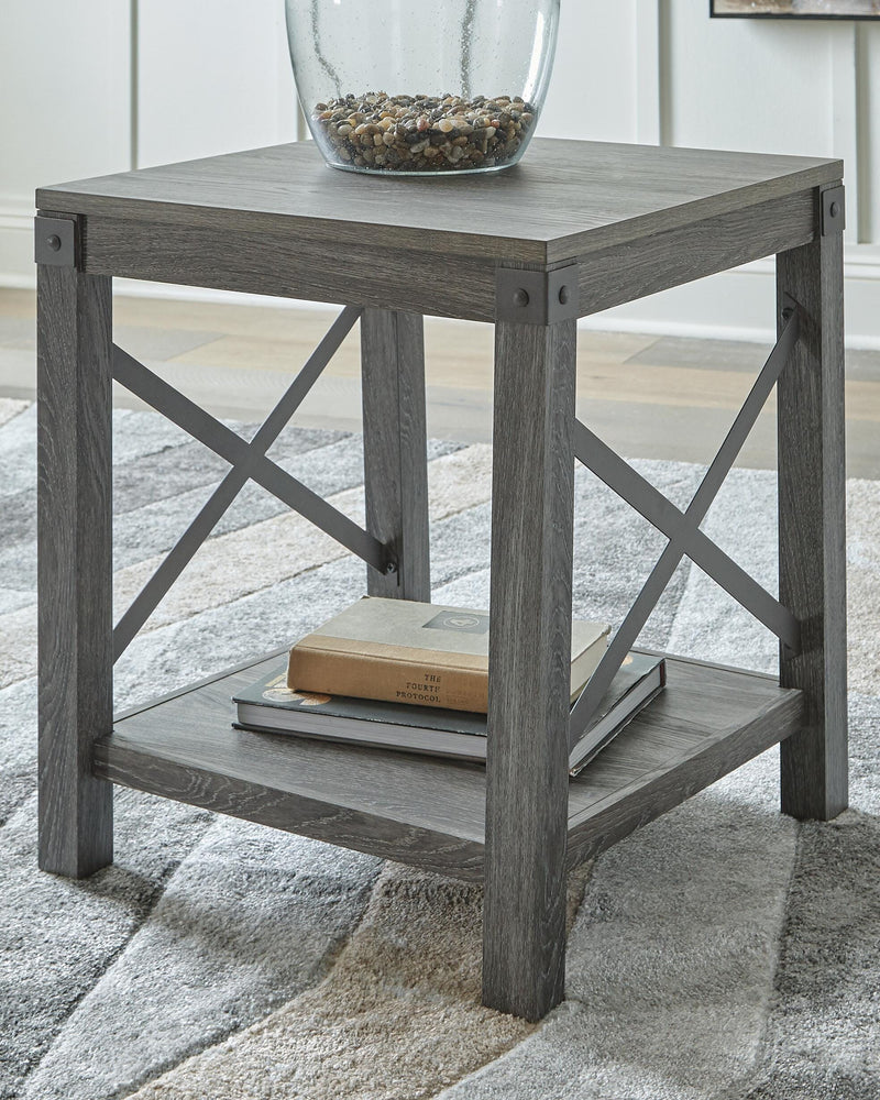 Ashley Furniture Freedan End Table with wood finish and modern design, featuring a sleek tabletop and sturdy legs.